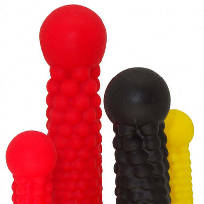 Premium silicone sex toys in various shapes and sizes, perfect for a sensual experience. High-quality craftsmanship. Close-up.