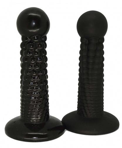 Two black, textured cannonball dildos from 1ATOYS made of premium platinum silicone with rounded heads and flat bases. Compare matte and glossy.