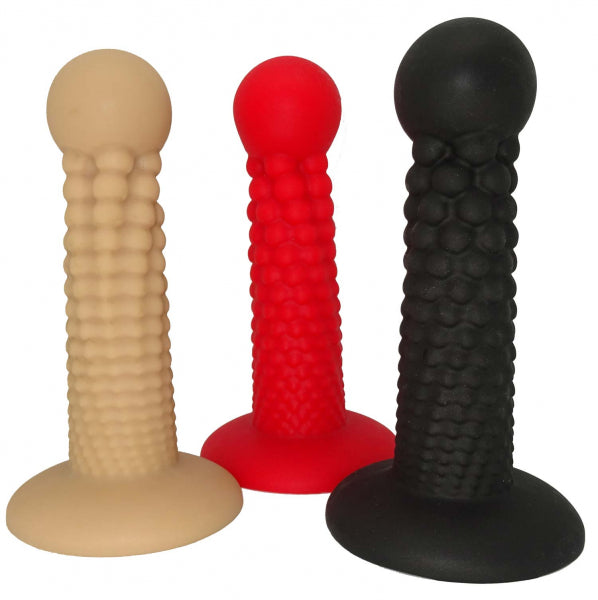 Cannonball dildo made of platinum silicone by 1ATOYS in beige, red, and black, with a knobby surface and a round ball as a glans substitute.